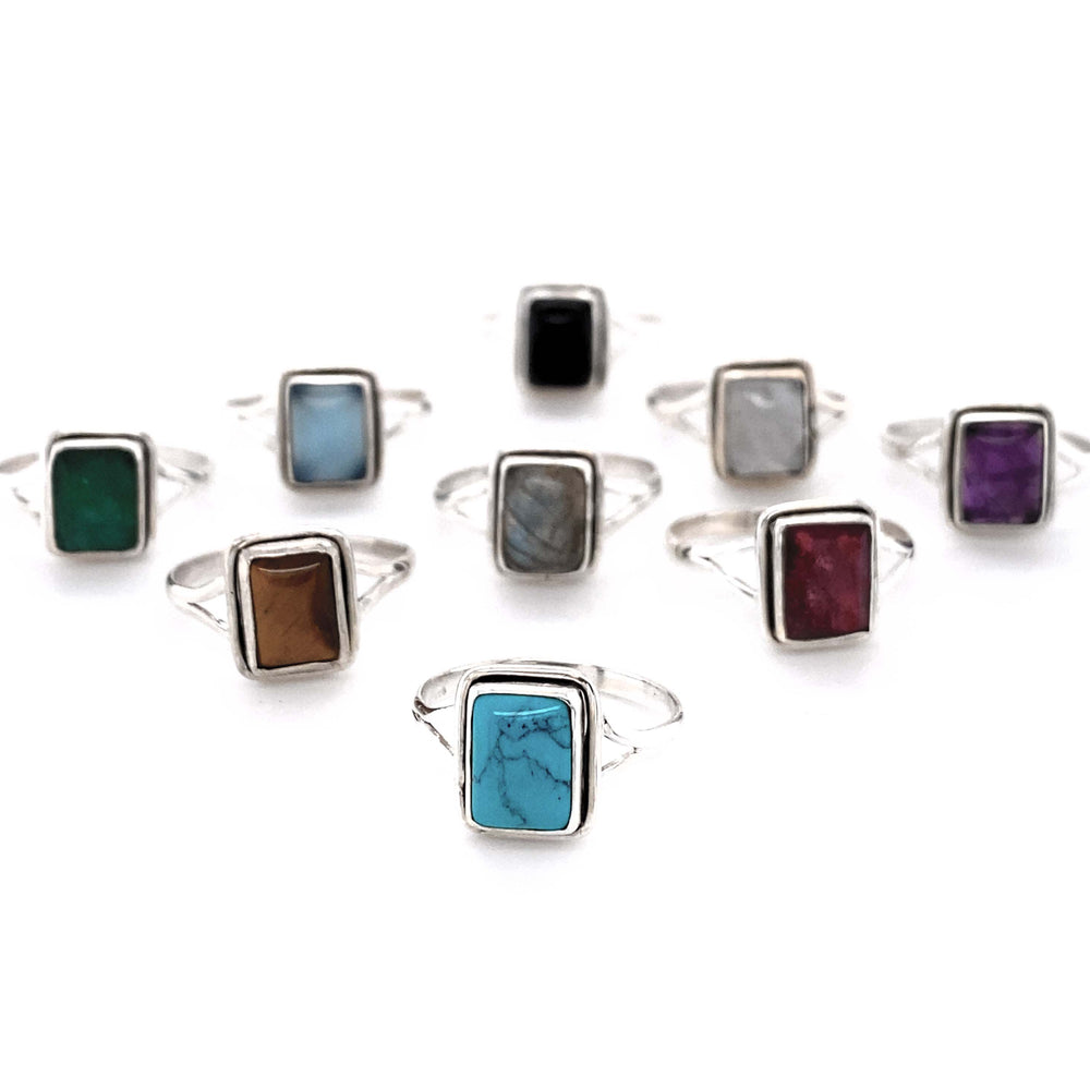 A set of Simple Square Gemstone Rings with stone accents.