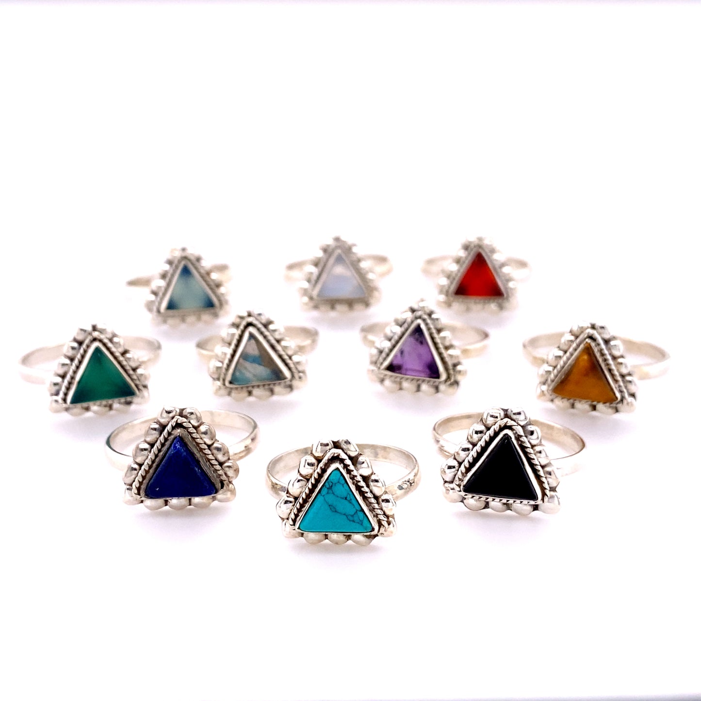 A set of Triangle Gemstone Rings with Beads, crafted in sterling silver, adorned with different colored stones.