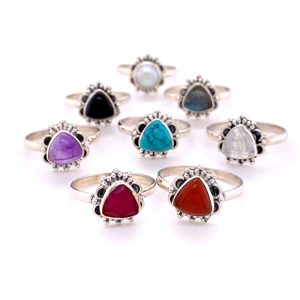 A set of Triangular Gemstone Ring with Frills, perfect for adding a touch of elegance and style to any outfit.