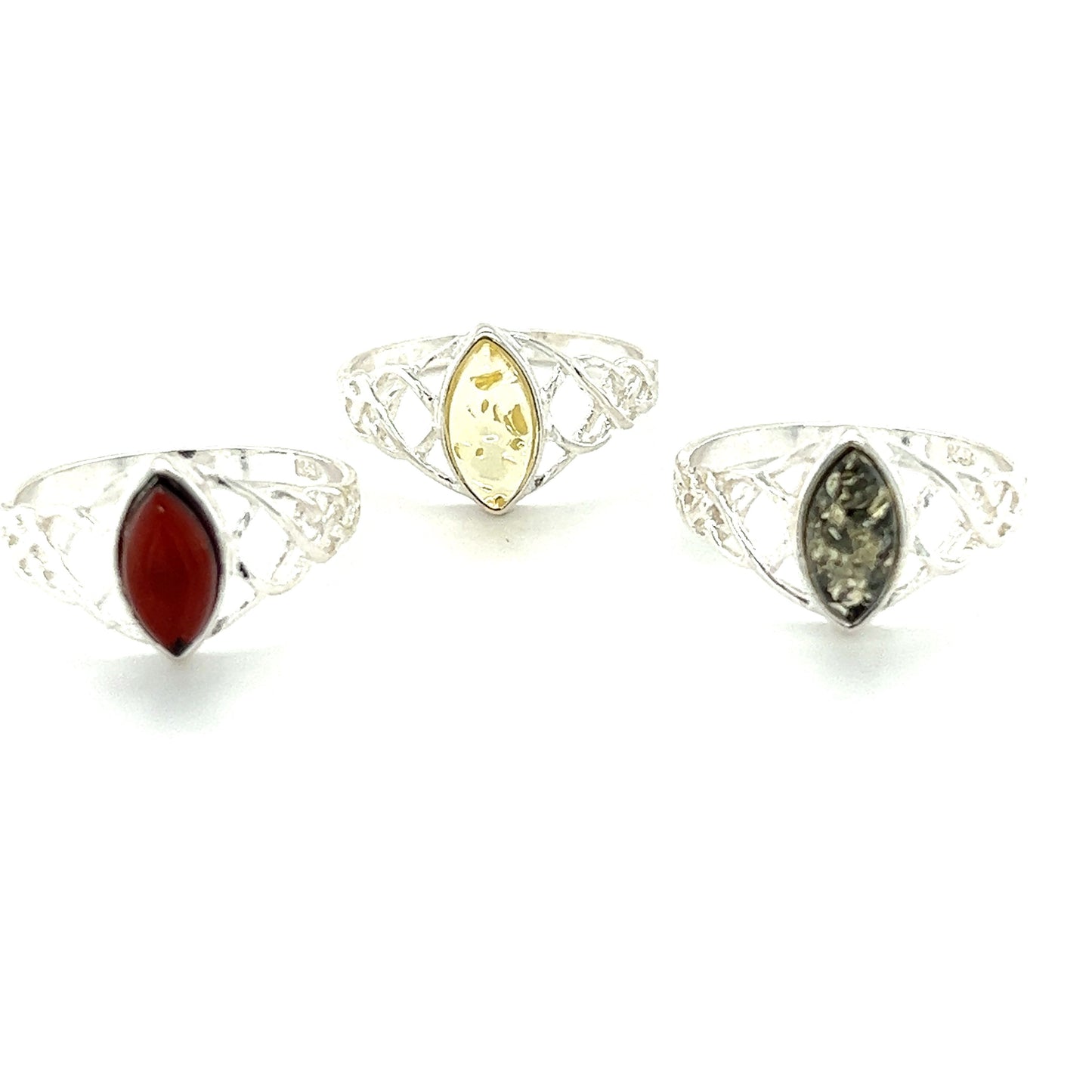 Baltic Amber Marquise Shaped Celtic Style ring with glowing amethyst and citrine by Super Silver.