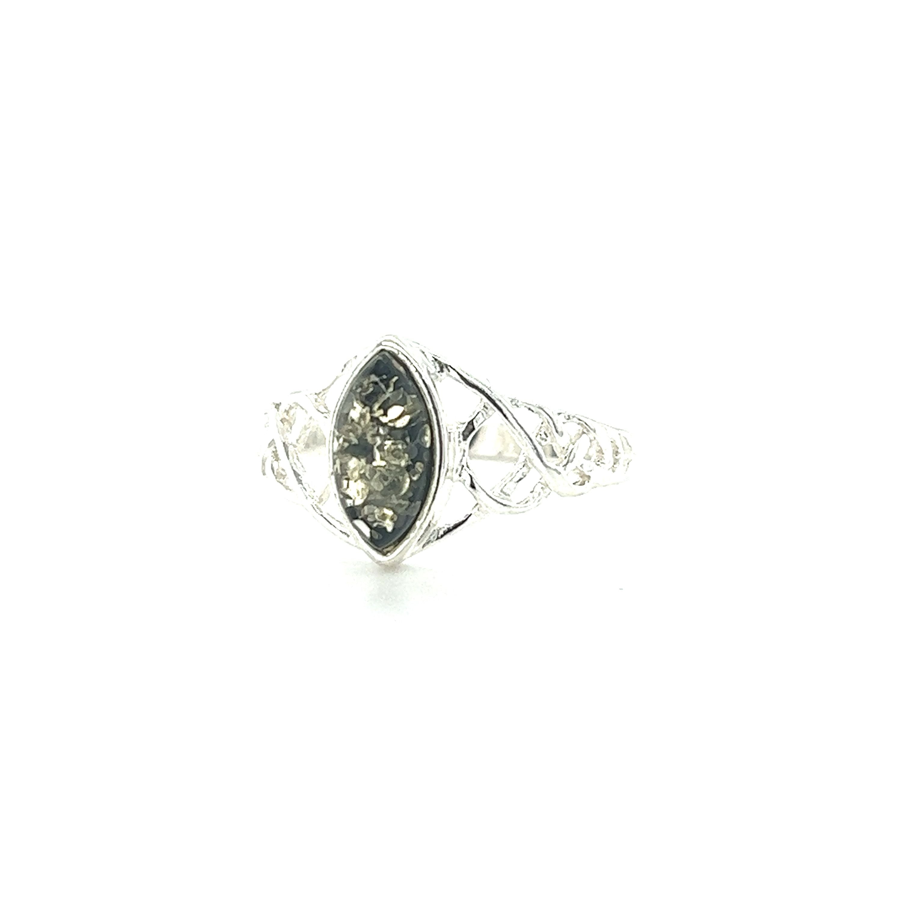 A Baltic Amber Marquise Shaped Celtic Style Ring from Super Silver with a black stone in it.