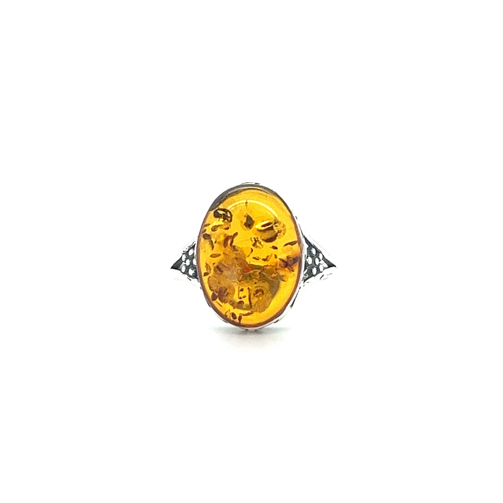 
                  
                    Super Silver's Baltic Amber Ring with Victorian Styled Floral Setting, exuding a boho chic style.
                  
                