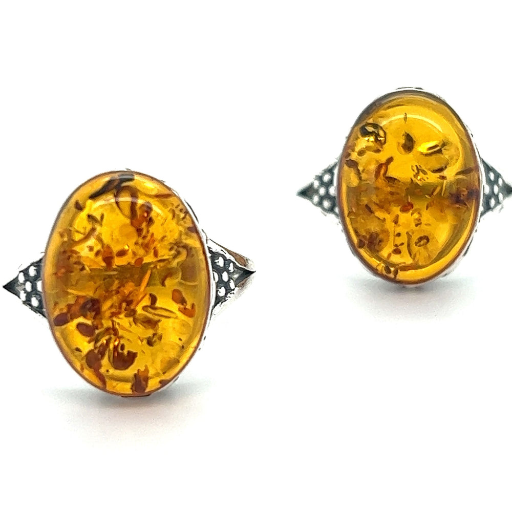 A pair of Super Silver baltic amber stud earrings, perfect for everyday style.