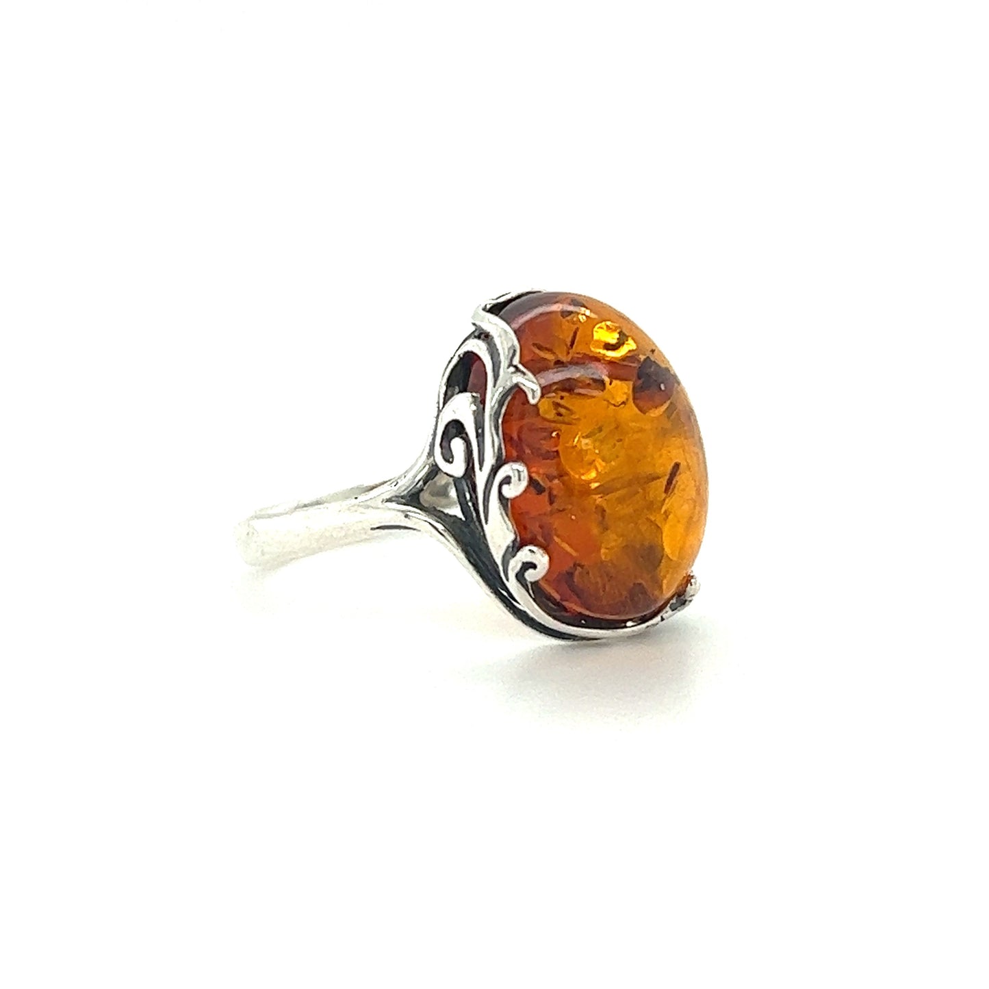 
                  
                    This Stunning Victorian Styled Amber Ring from Super Silver showcases a beautiful Baltic amber stone, creating a captivating and earthly accessory.
                  
                