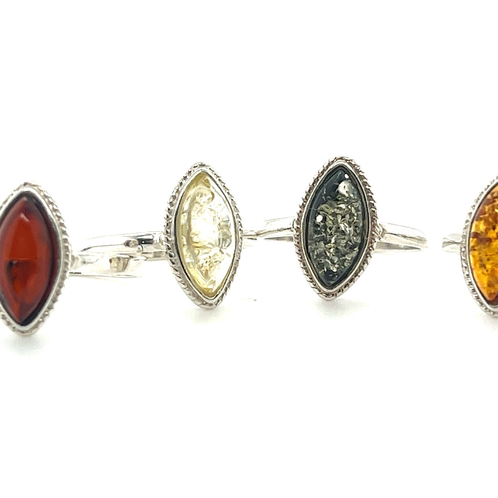 A set of Marquise Baltic Amber Rings with Delicate Rope Border, including Super Silver rings.