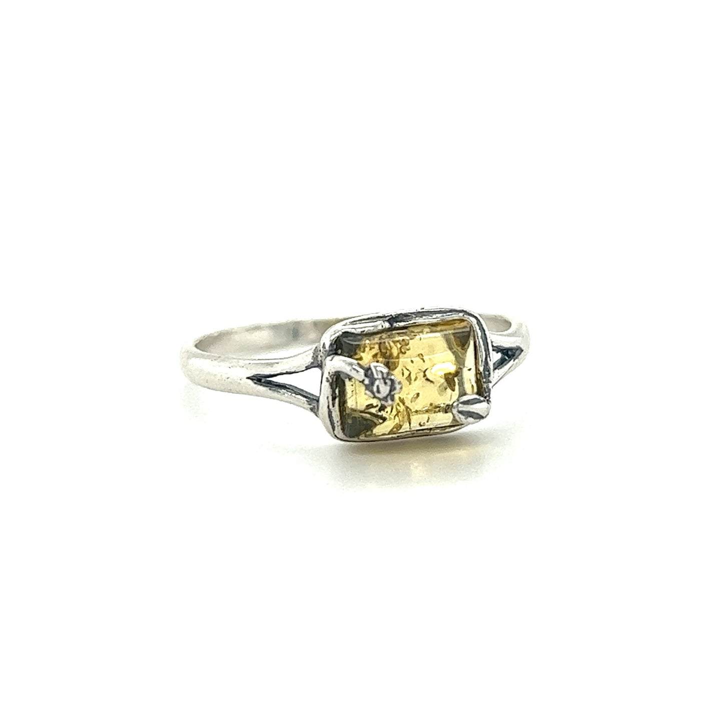 
                  
                    A Super Silver Rectangle Amber Ring with Nature Detailing featuring a yellow sapphire and diamonds.
                  
                