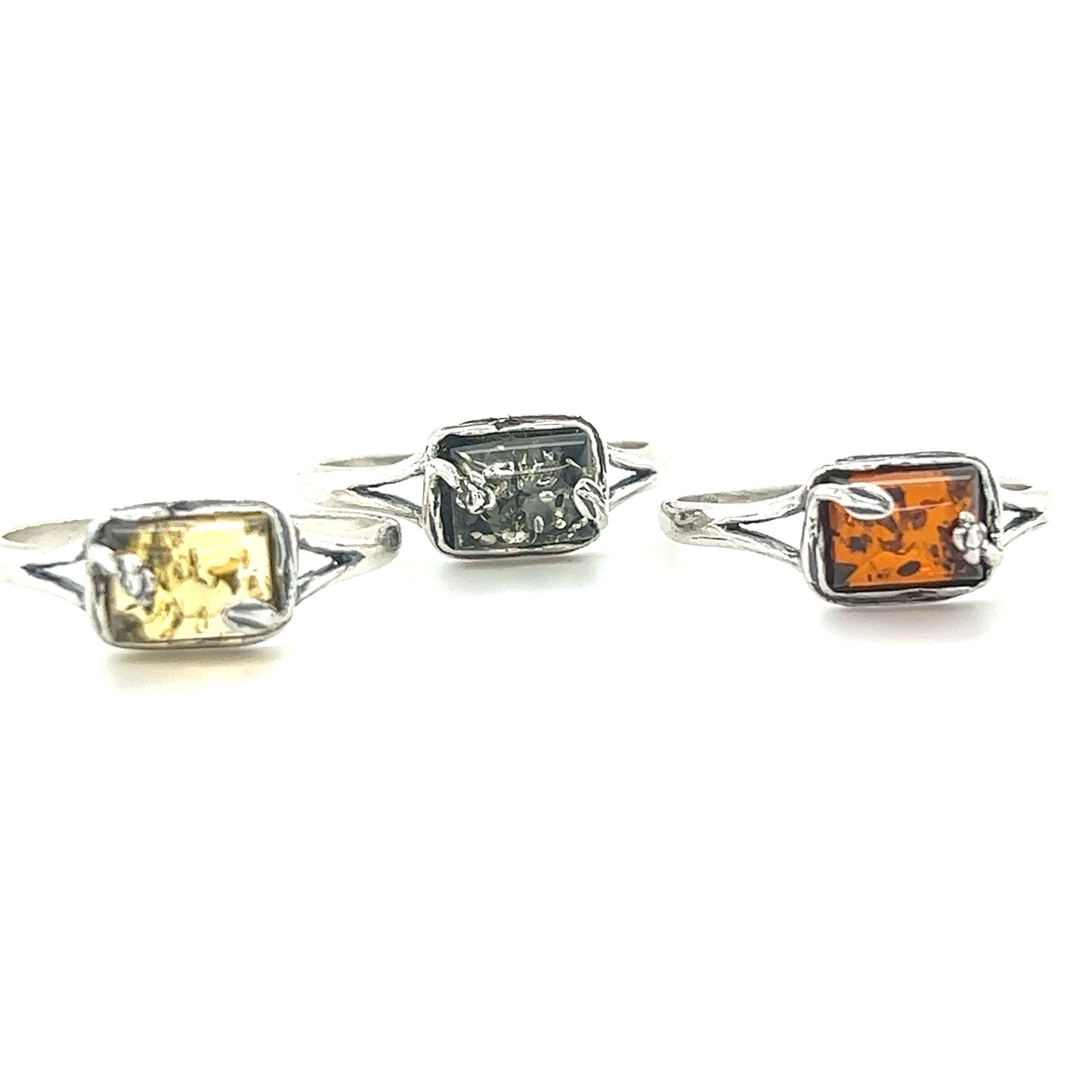 
                  
                    A set of three Rectangle Amber Rings with Nature Detailing on Super Silver bands.
                  
                