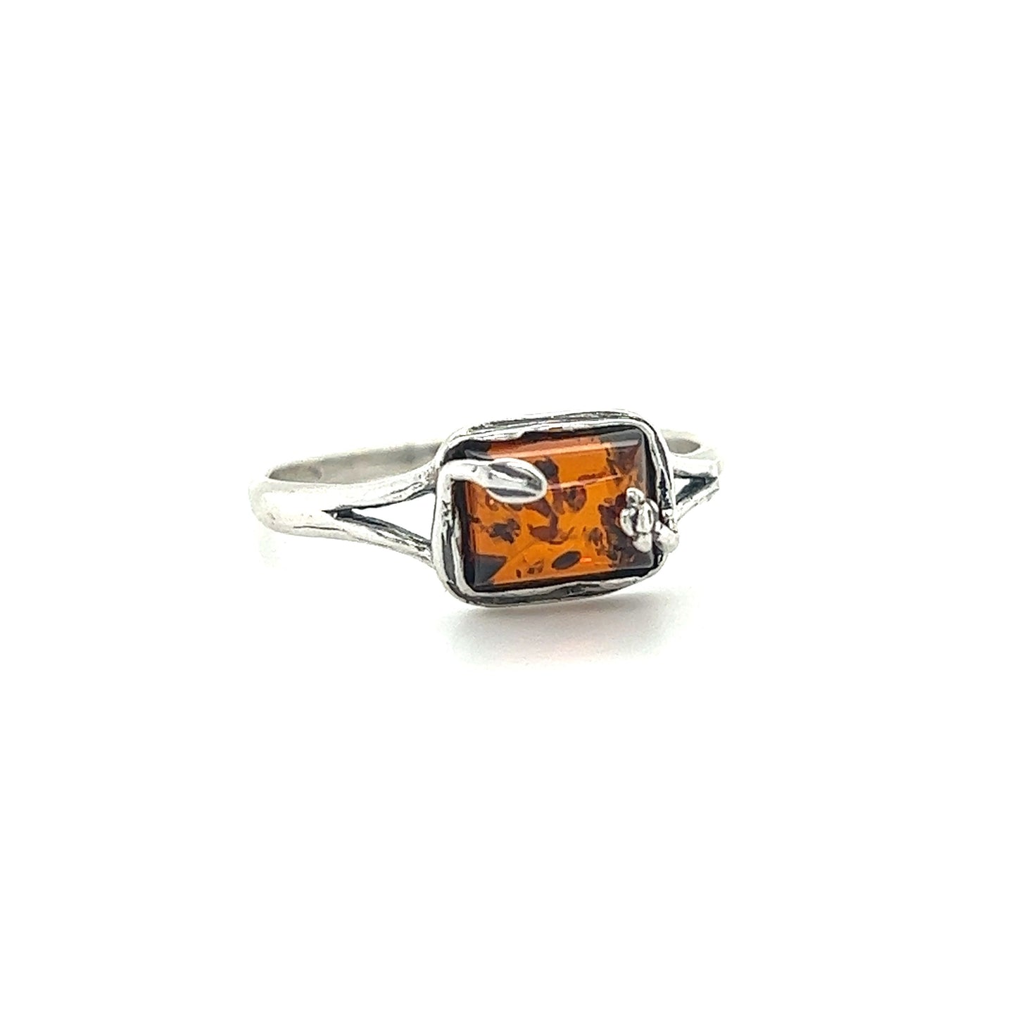 
                  
                    A Super Silver Rectangle Amber Ring with Nature Detailing featuring a square Baltic Amber stone.
                  
                