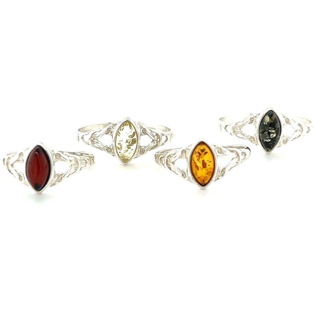 
                  
                    A set of Delicate Celtic Inspired Amber Rings by Super Silver with Baltic amber, amethyst, and carnelian stones. These rings not only showcase the natural beauty of these gemstones but also offer healing and spiritual growth.
                  
                