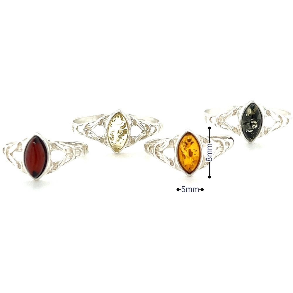 
                  
                    A Delicate Celtic Inspired Amber Ring adorned with Baltic amber stones, promoting healing and spiritual growth, by Super Silver.
                  
                