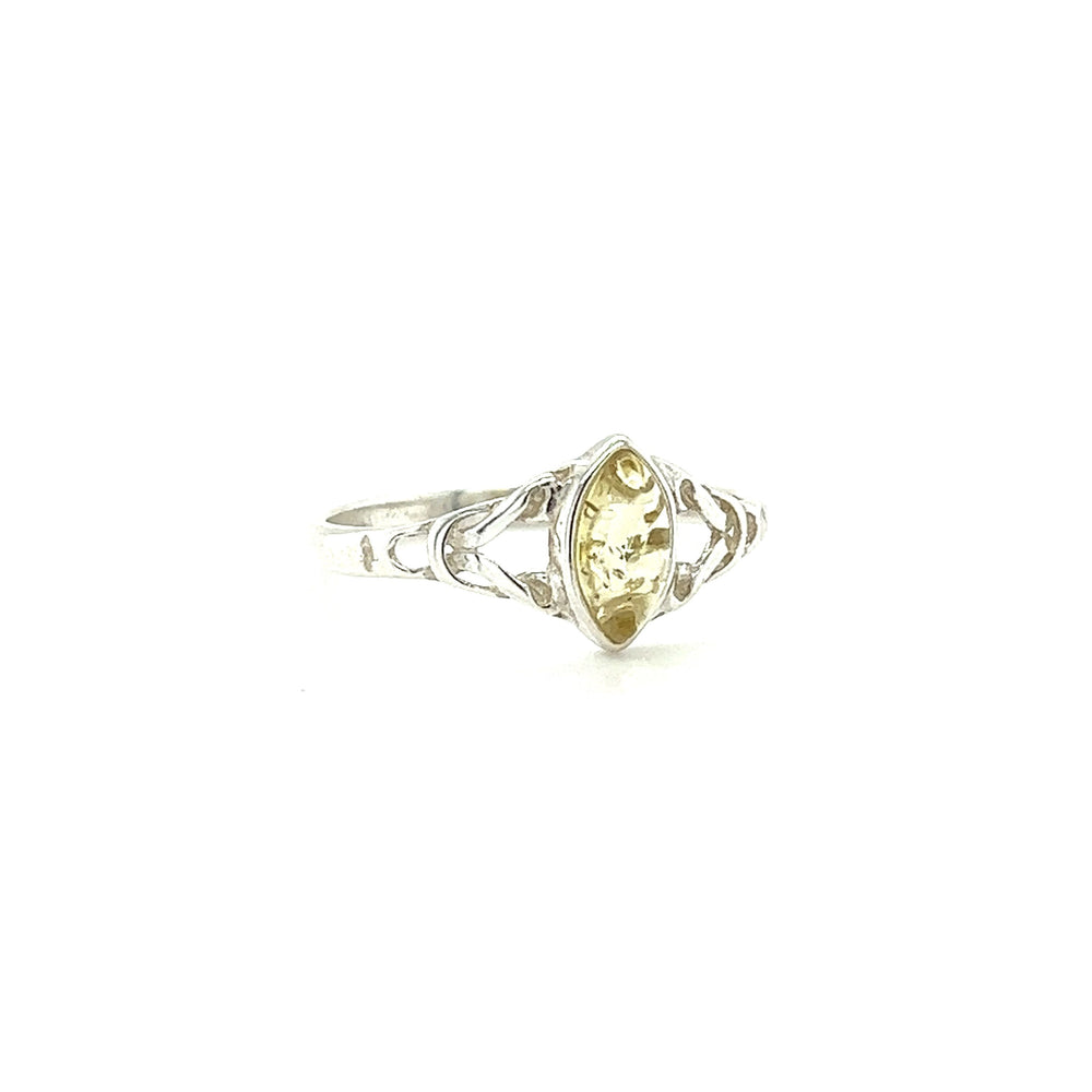 
                  
                    A Delicate Celtic Inspired Amber Ring with an oval citrine stone, perfect for spiritual growth and made with .925 Sterling Silver, by Super Silver.
                  
                