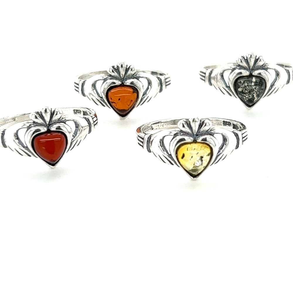 
                  
                    Super Silver Claddagh Amber Heart Ring with amethyst, symbolizing love and friendship.
                  
                