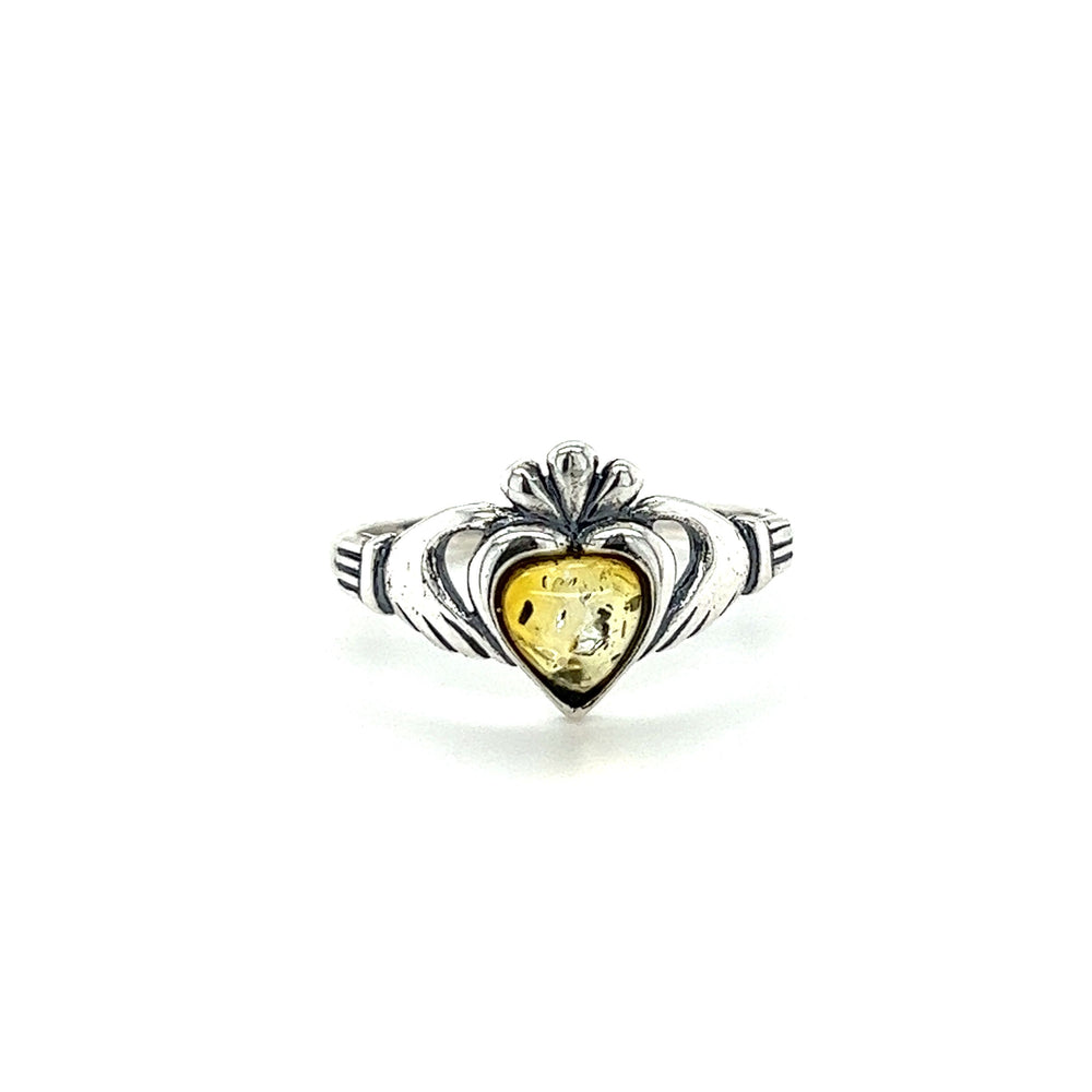 
                  
                    A Super Silver Claddagh Amber Heart Ring, with a yellow stone symbolizing love and friendship.
                  
                