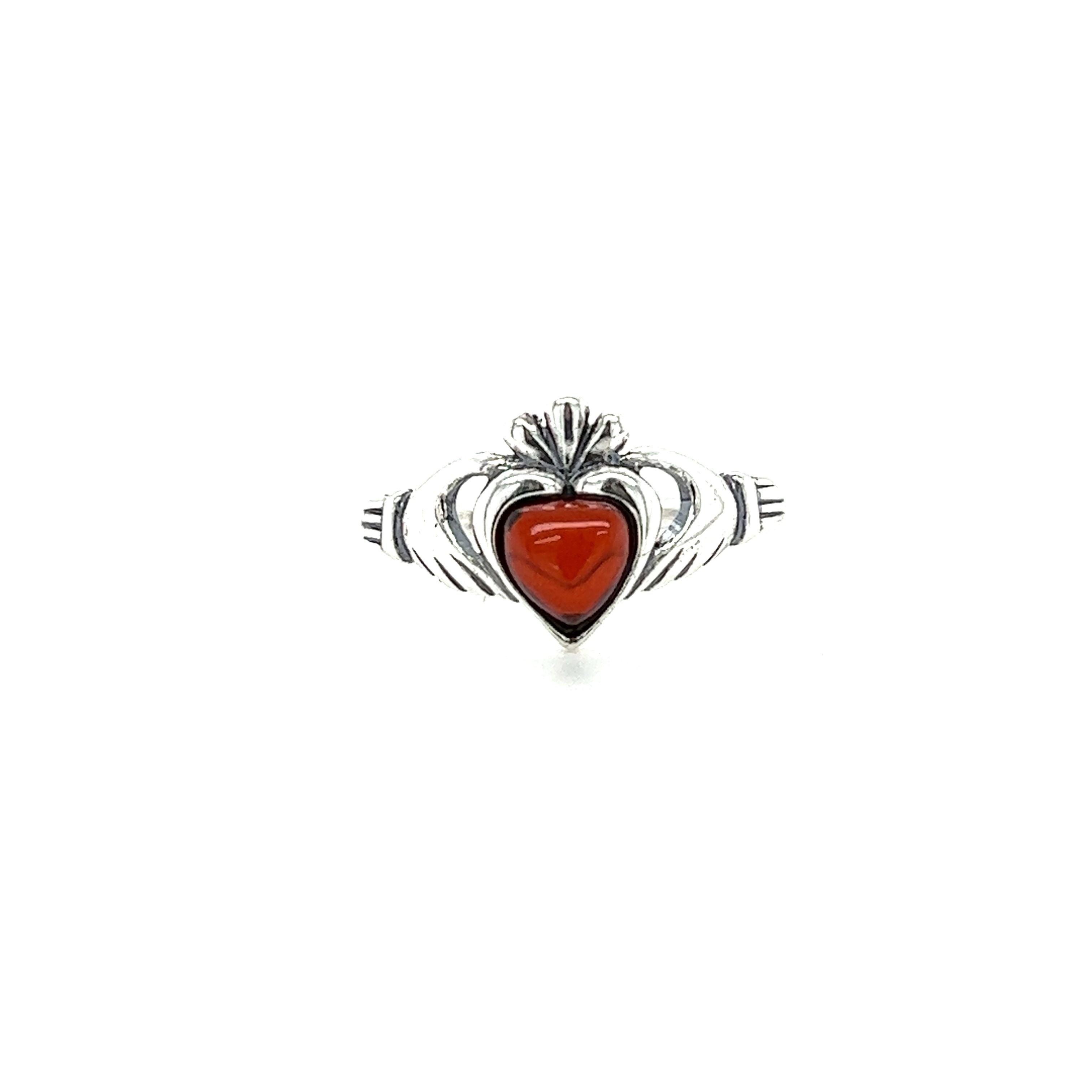 A Super Silver Claddagh Amber Heart Ring, made of .925 Sterling Silver, features a beautiful Baltic amber stone and symbolizes love and friendship.