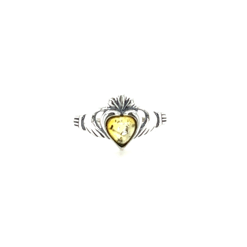 
                  
                    A Super Silver Claddagh Amber Heart Ring with a yellow stone, symbolizing love and friendship. Made of .925 Sterling Silver, featuring a Claddagh Baltic amber ring.
                  
                