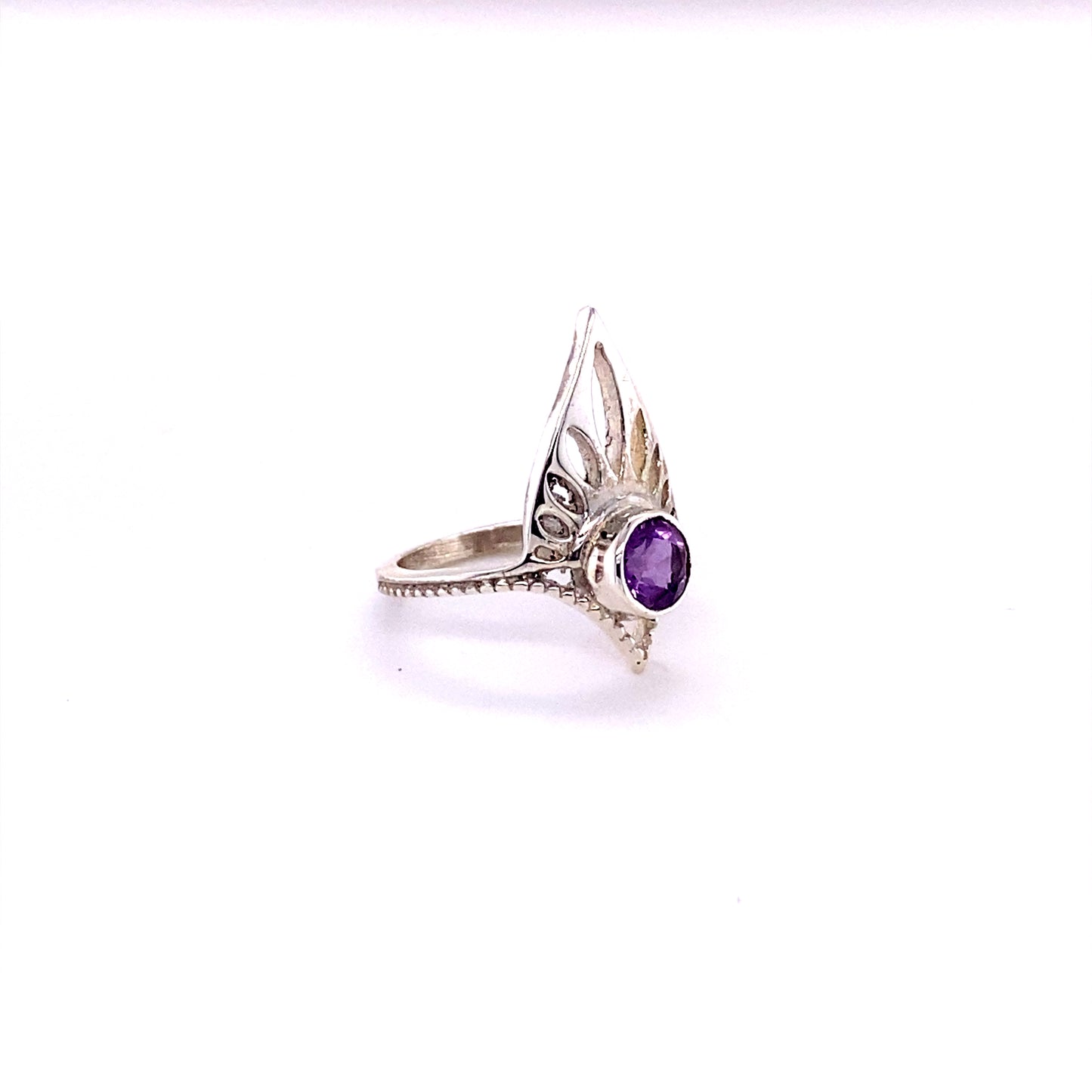 
                  
                    A Henna Shield Ring with Natural Gemstones, a sterling silver amethyst ring with a purple stone.
                  
                