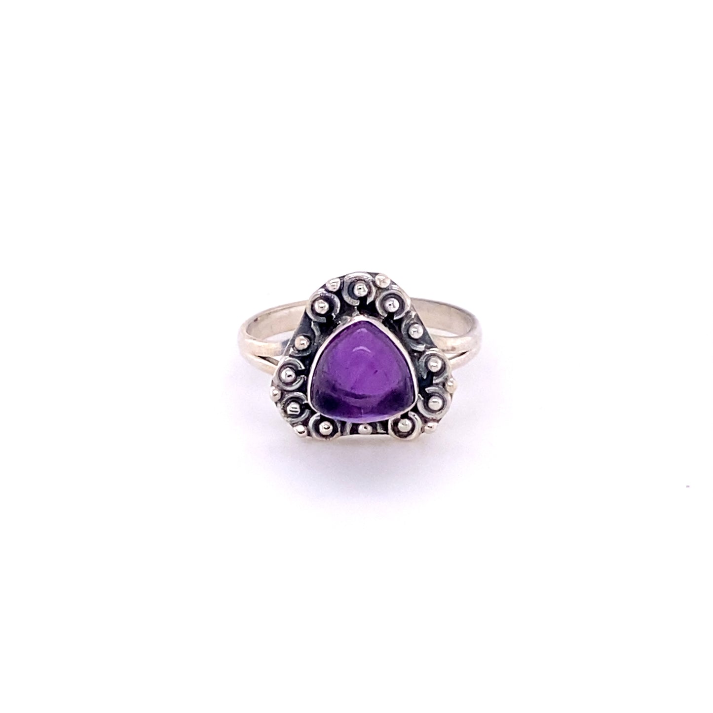 
                  
                    Triangular Gemstone Ring with A Flat Ball Boarder in sterling silver. This stunning piece features a lustrous cabochon amethyst set elegantly in a mesmerizing sterling silver band, perfect for both the bohemian at heart.
                  
                