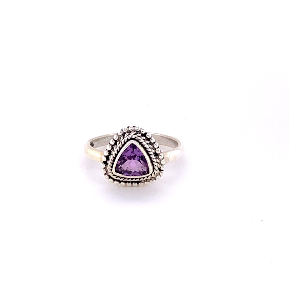 
                  
                    Hippie-inspired Triangle Gemstone Ring with Rope Border set in sterling silver.
                  
                