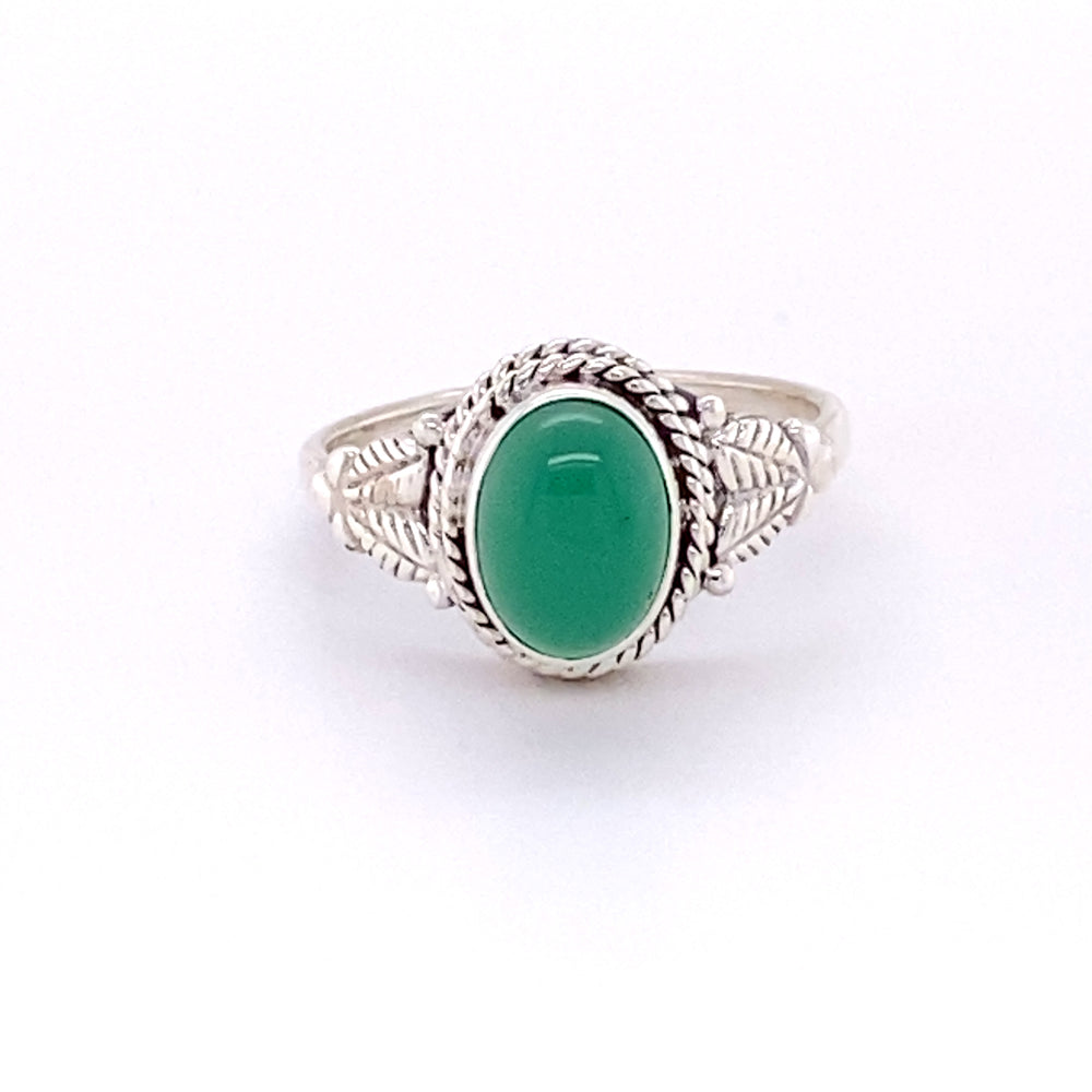 A Oval Aventurine Ring with Intricate Rope and Leaf Border with a green cabochon stone.