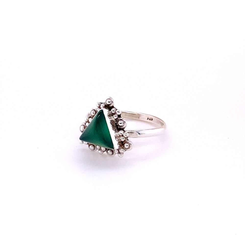 
                  
                    A Delicate Gemstone Triangle Ring with an emerald green stone from Santa Cruz.
                  
                