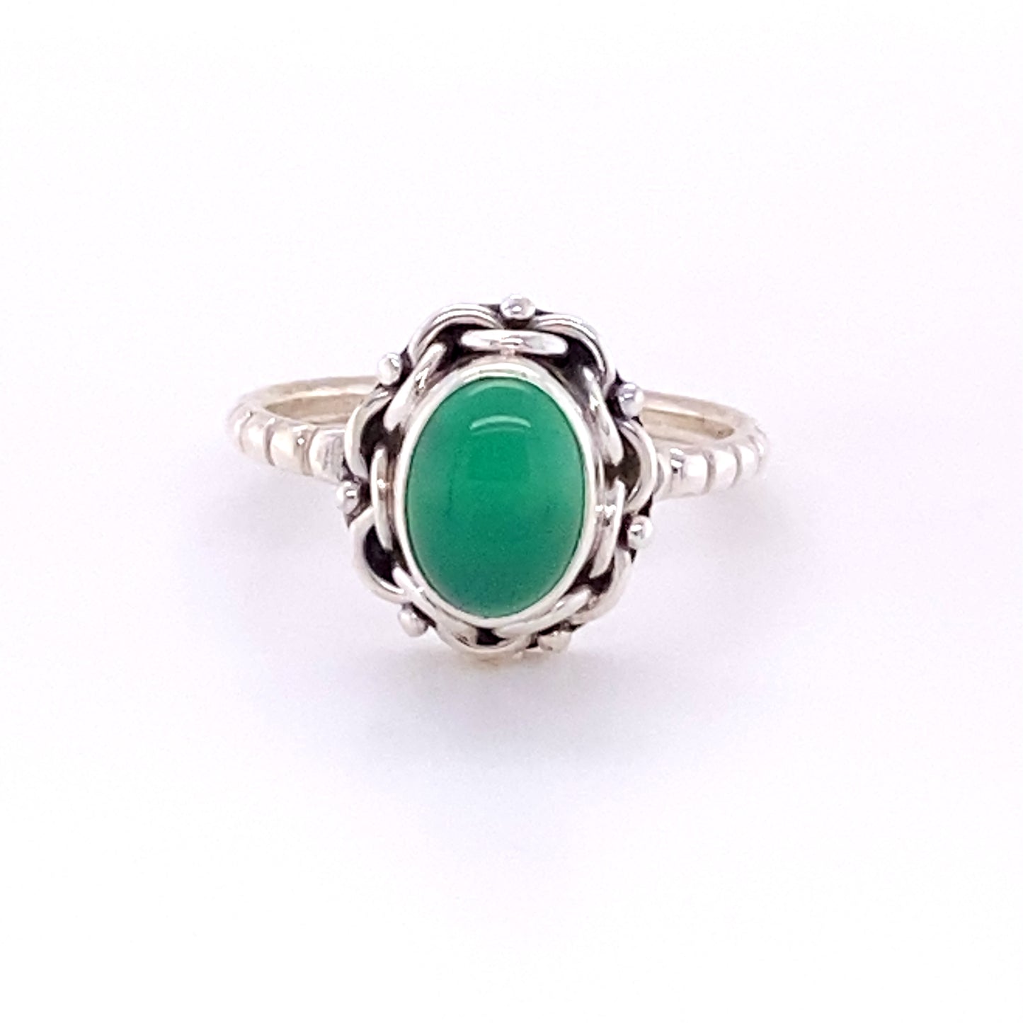A Natural Oval Gemstone Ring with Intricate chain Border and Textured Band with a green jade stone.