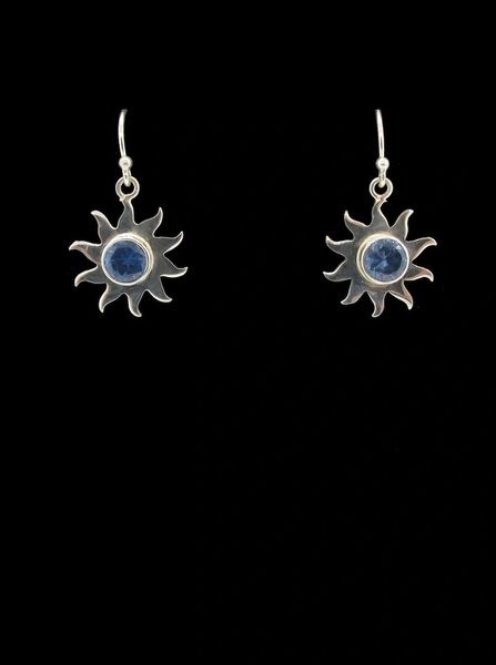 A stunning pair of Super Silver Blue Topaz Sun Star Earrings with blue sapphires.