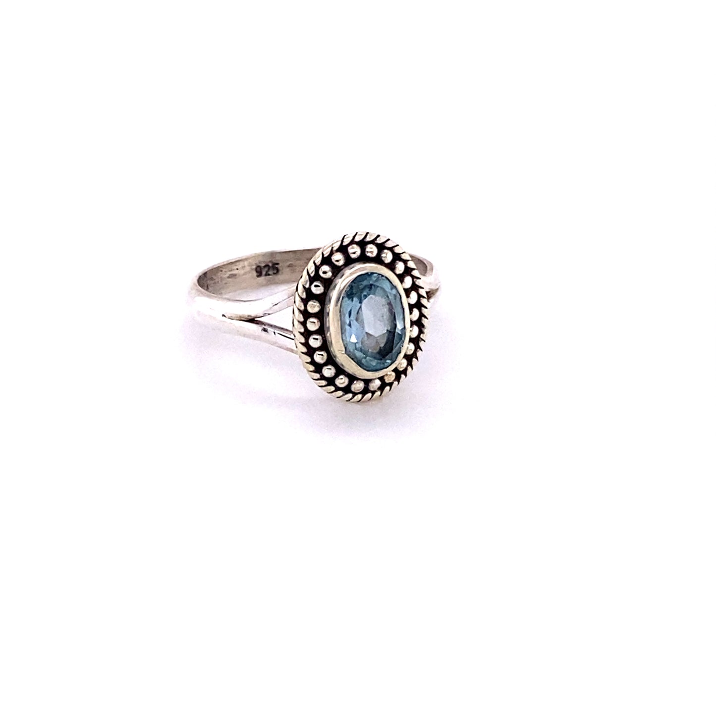 
                  
                    An Oval Gemstone Ring with Ball Disk Rope Border with a boho blue topaz stone.
                  
                