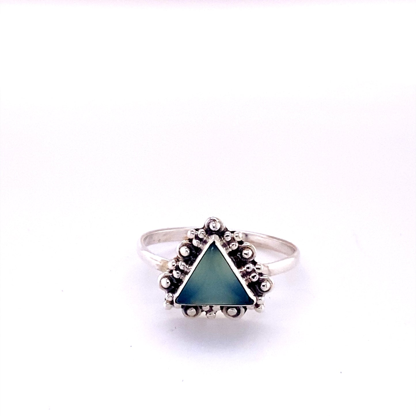
                  
                    A Delicate Gemstone Triangle Ring with a turquoise stone in the middle.
                  
                
