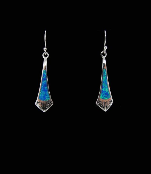 A pair of elegant Super Silver blue created opal elongated tie shape earrings with a rhodium finish, showcased on a black background.