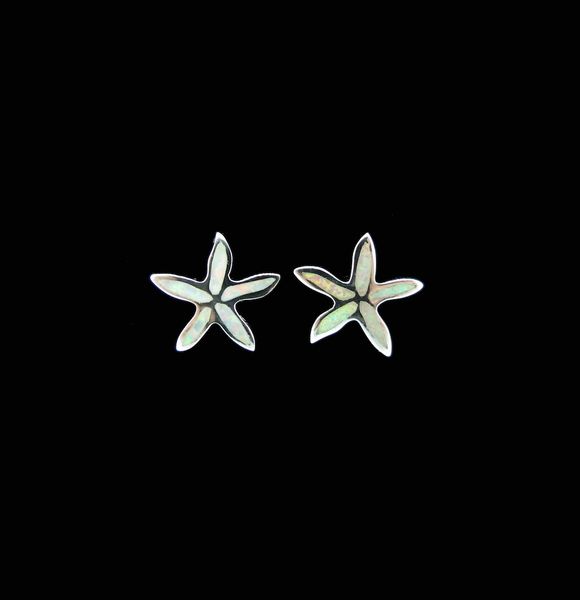 A pair of White Created Opal Star Fish Stud Earrings by Super Silver on a black background.