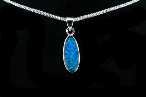 
                  
                    A Super Silver Blue Opal Oval Pendant on a rhodium-finished silver chain.
                  
                