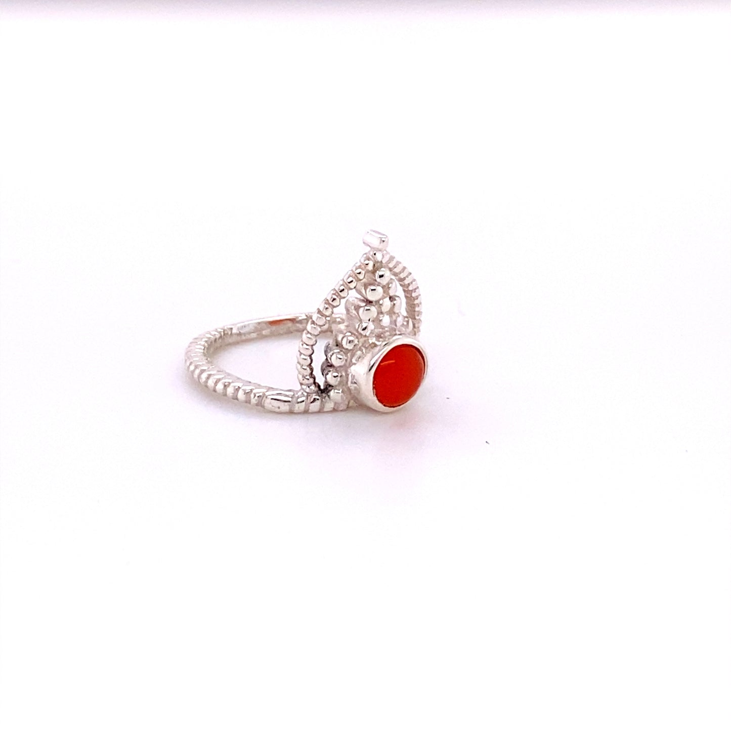 
                  
                    A Simple Tiara Ring with Natural Gemstones, with an orange cabochon stone.
                  
                