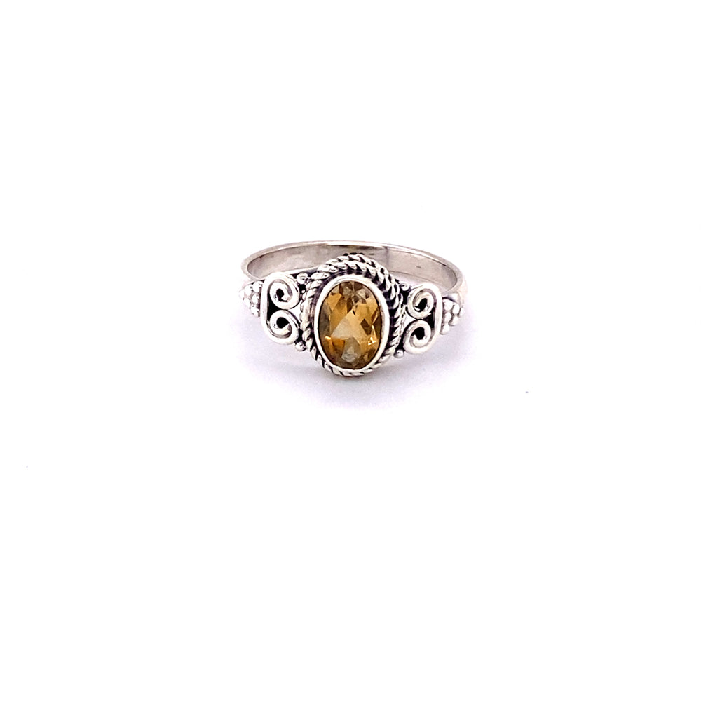 
                  
                    Oval Faceted Gemstone Ring with a Swirl Design
                  
                