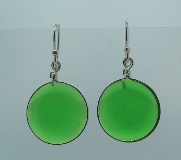 A pair of Super Silver Green Stone Glass Dangle Earrings on a white surface.