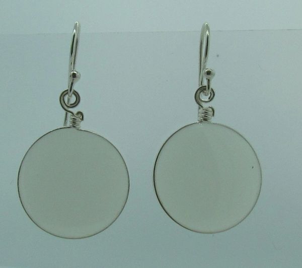 These light weight Super Silver sterling silver White Round Glass Dangle Earrings feature a white glass disc set behind glass.
