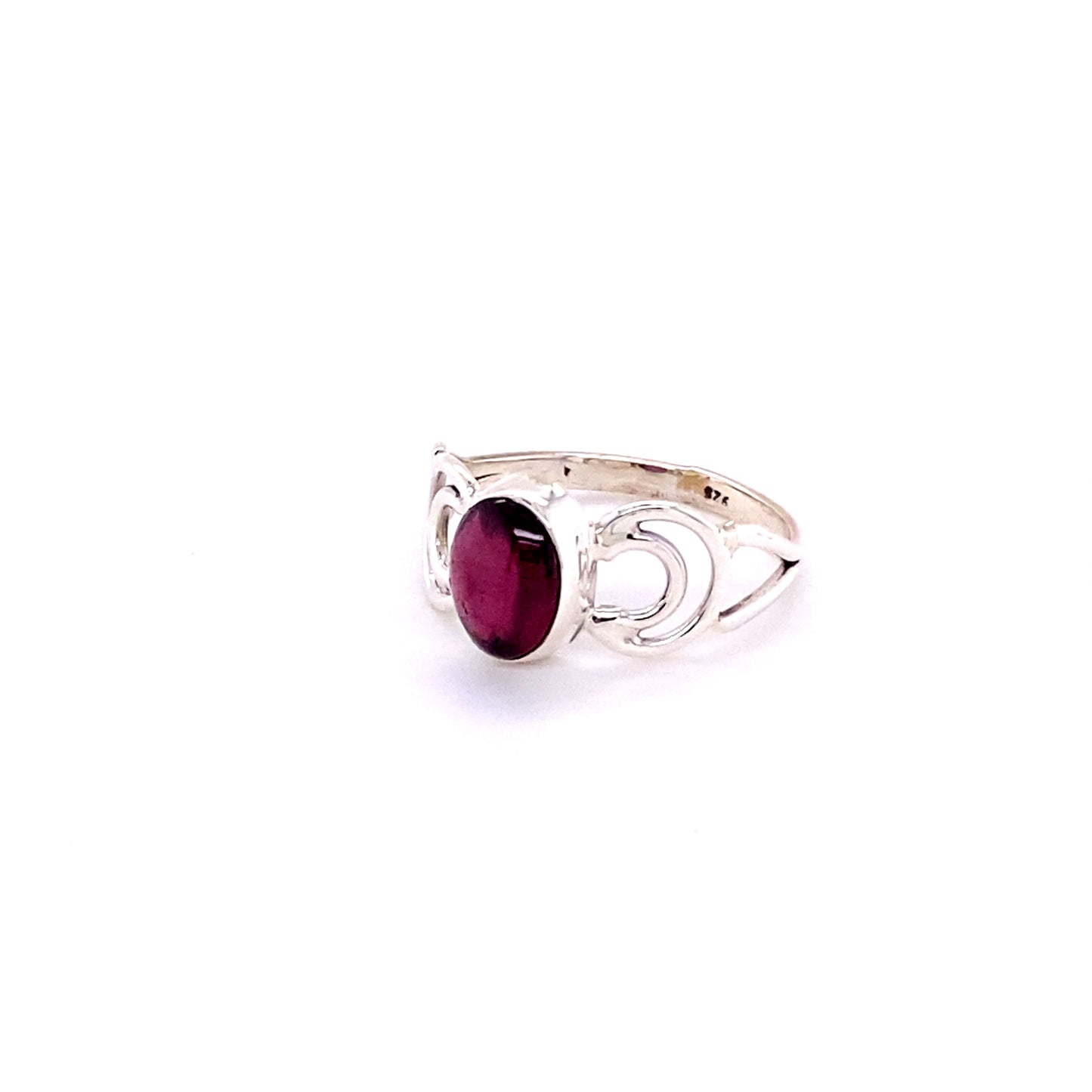 
                  
                    An oval gemstone ring with moon design featuring a vibrant ruby stone.
                  
                