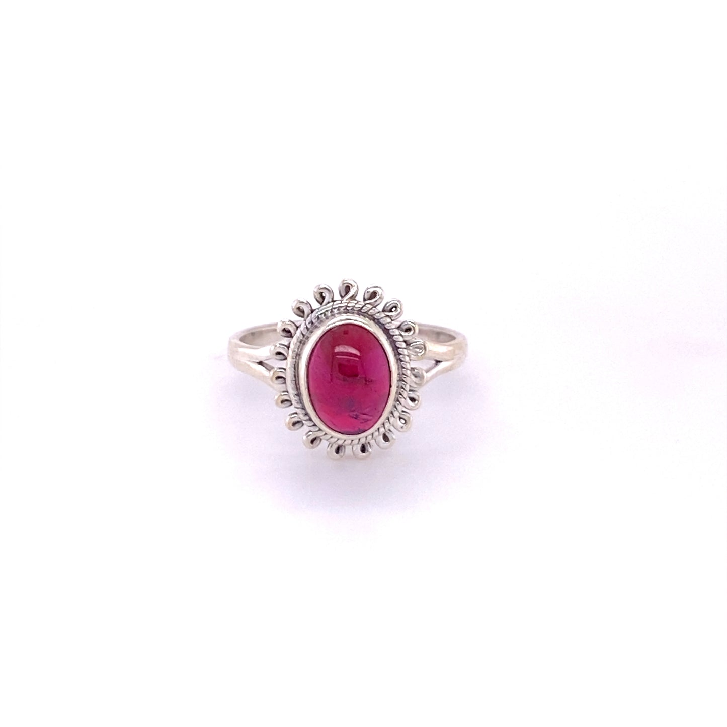 A Hippie-Chic Oval Gemstone Flower ring with a cabochon ruby stone.