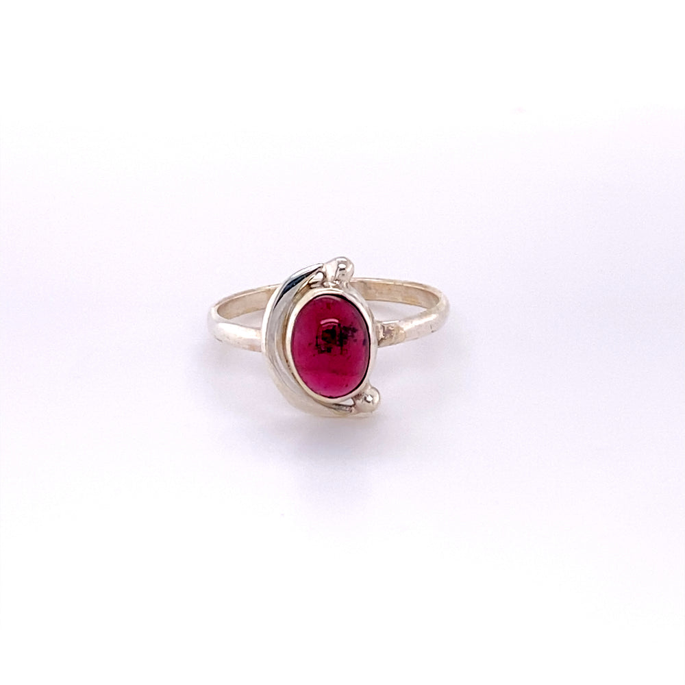 
                  
                    A boho Oval Crescent Moon ring with a ruby cabochon stone in the middle.
                  
                