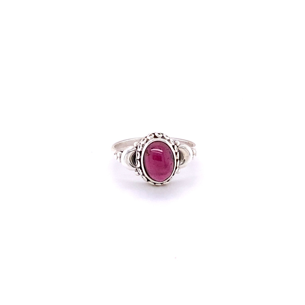 
                  
                    A beautiful oval gemstone ring with small moons.
                  
                