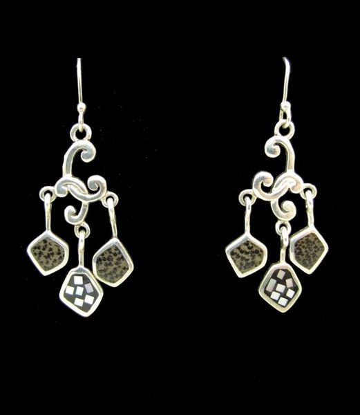 A pair of Super Silver Mother of Pearl Dangly Silver Earrings adorned with Mother of Pearl accents.