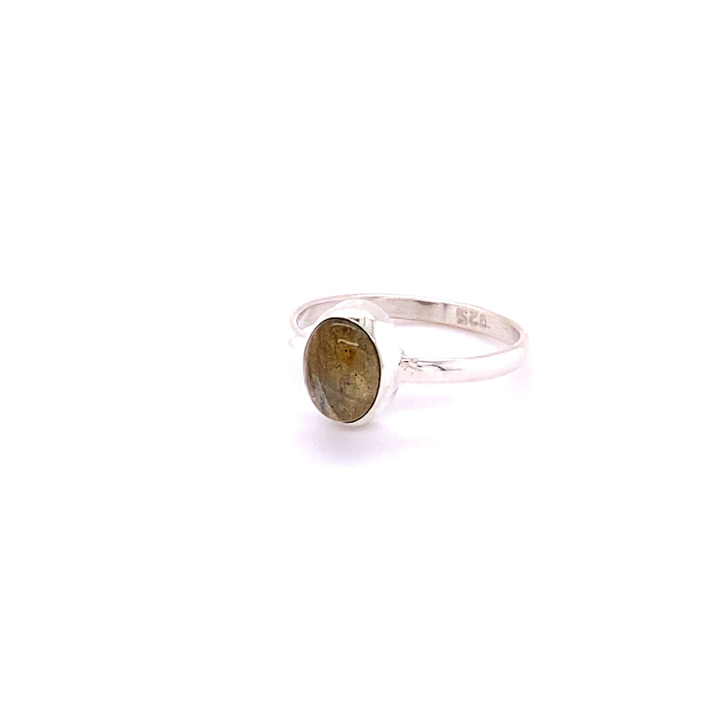 
                  
                    A boho Simple Oval Natural Gemstone Ring with a yellow labradorite cabochon stone.
                  
                