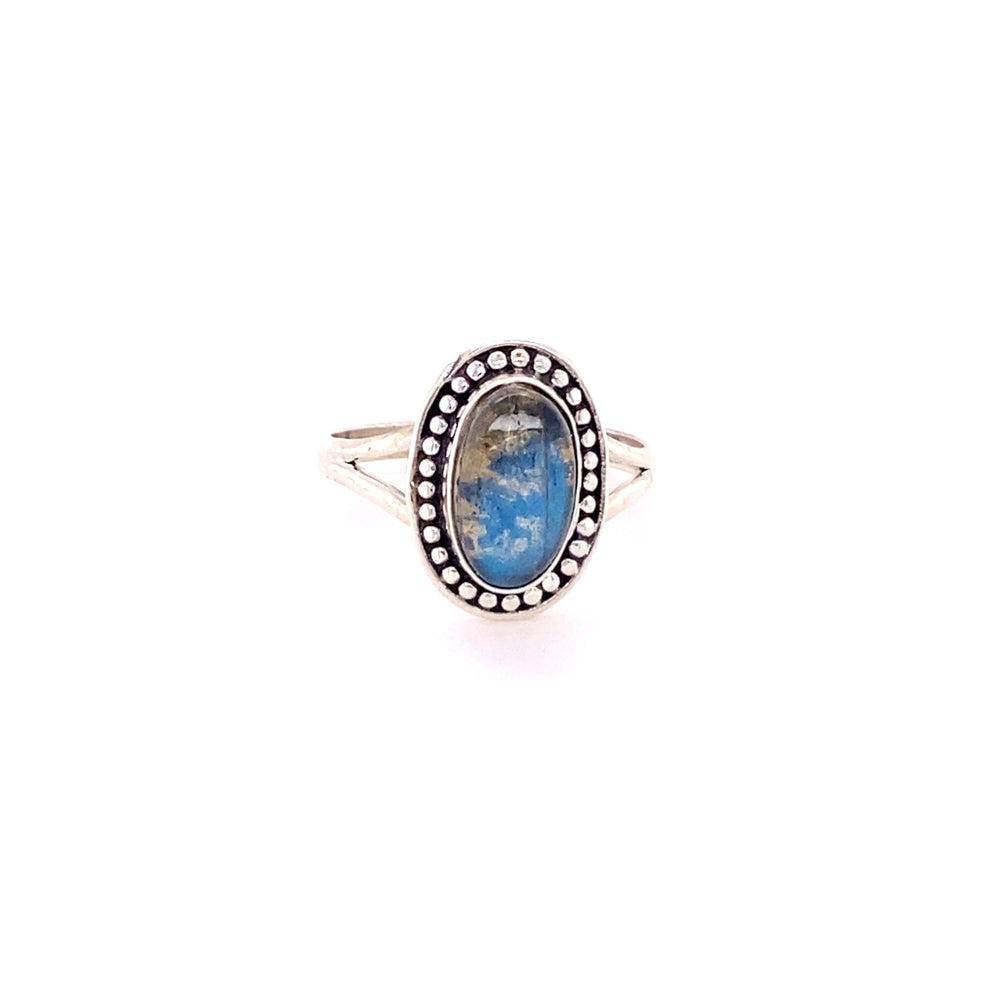 A Super Silver Trendy Oval Ring with a blue stone in the center.
