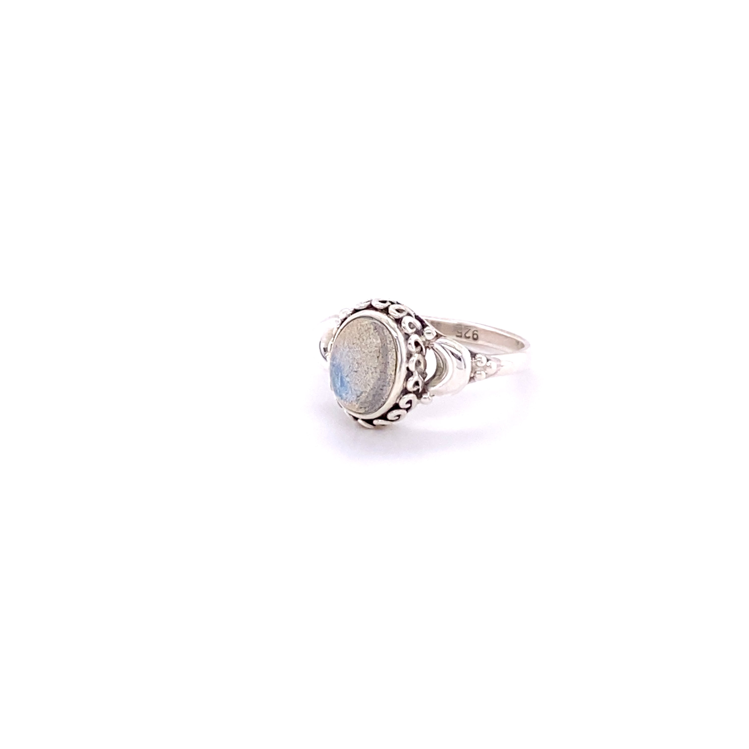 A sterling silver ring with a Beautiful Oval Gemstone Ring with Small Moons cabochon stone.