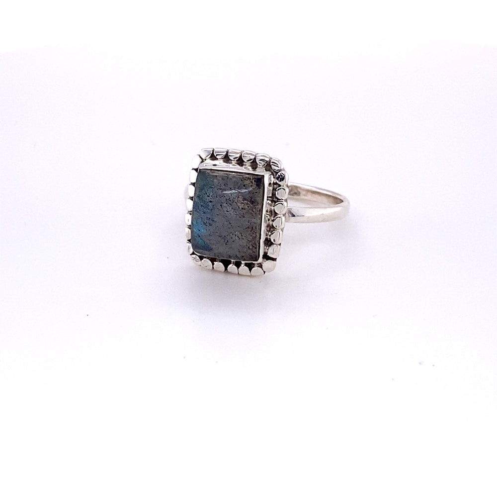 
                  
                    Square ring with natural gemstones with a boho vibe in sterling silver.
                  
                