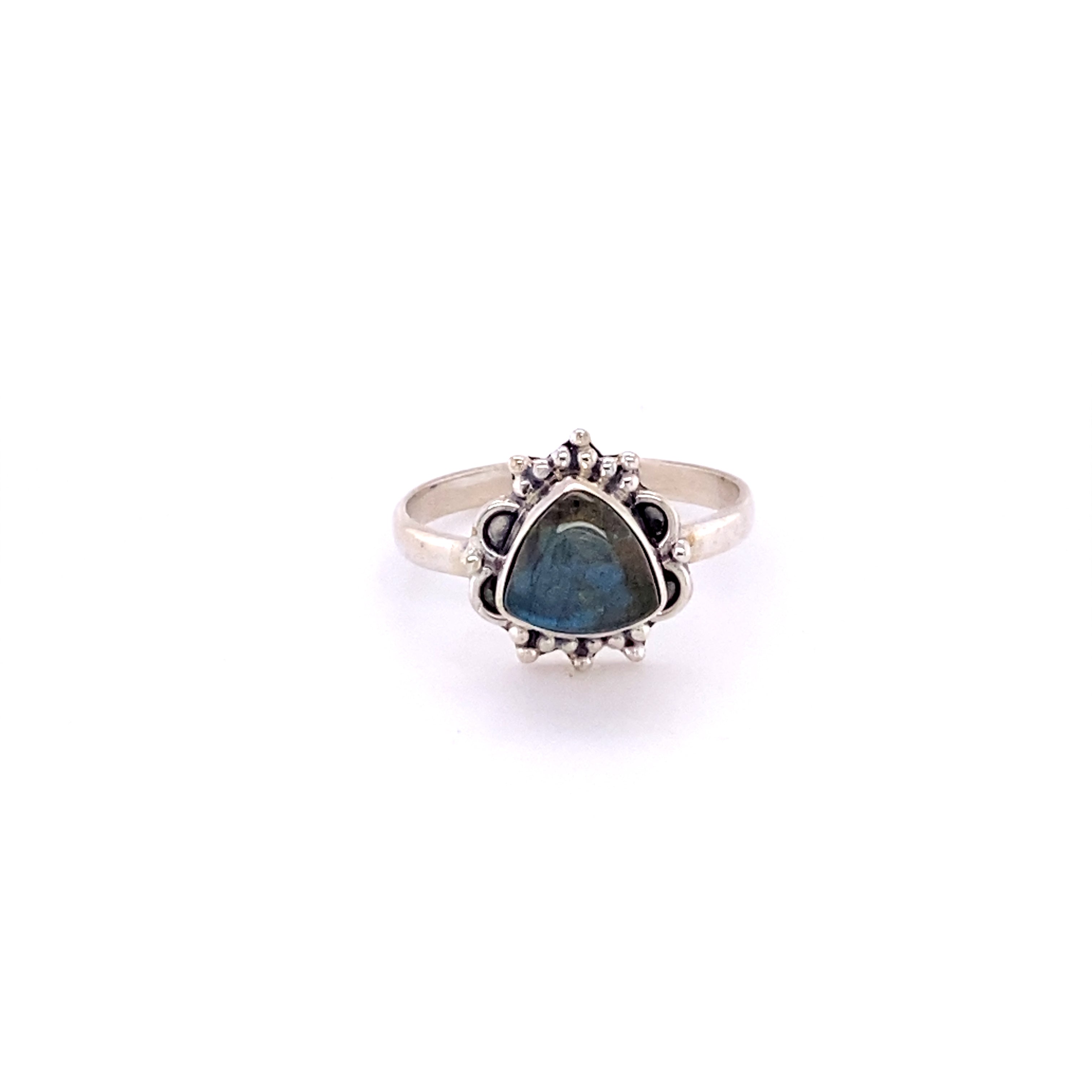 A Triangular Gemstone Ring with Frills from Super Silver with a blue gemstone in the middle.