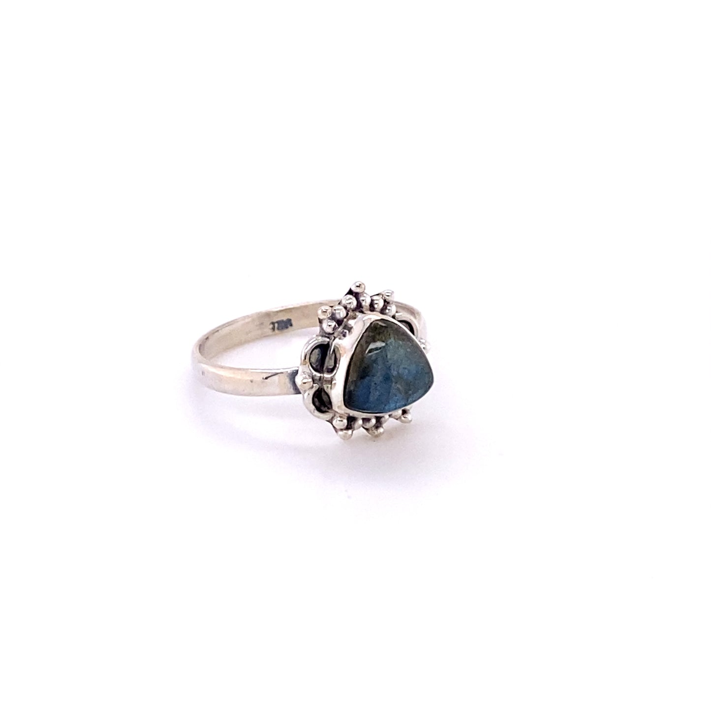 
                  
                    A triangular gemstone ring with frills, perfect for the hippie at heart or as a souvenir from Santa Cruz.
                  
                