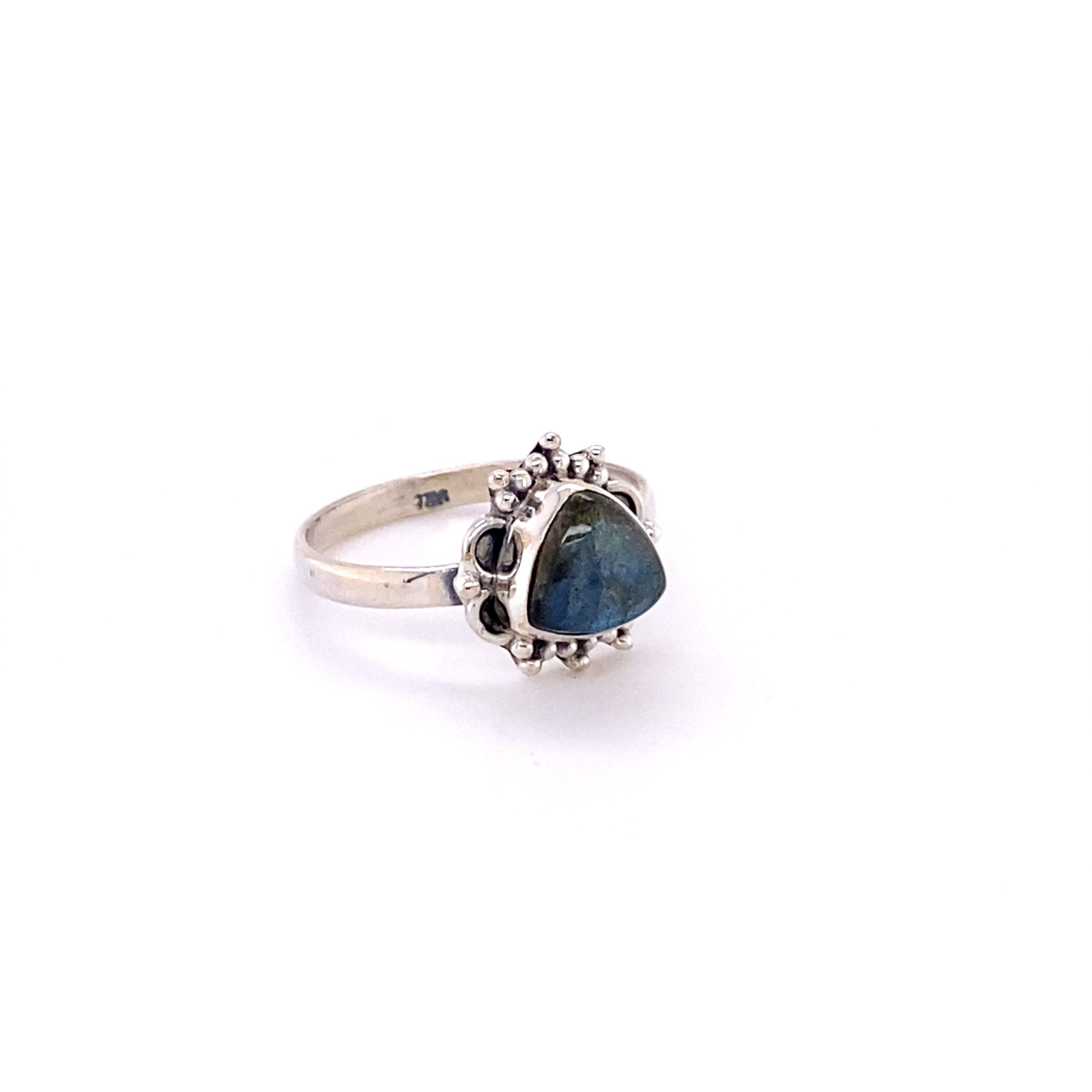 A triangular gemstone ring with frills, perfect for the hippie at heart or as a souvenir from Santa Cruz.