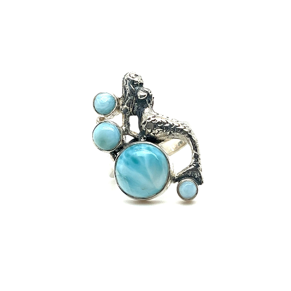 A Mermaid Ring with Larimar adorned with sparkling blue stones, perfect for ocean lovers in Santa Cruz. Made with high-quality sterling silver.