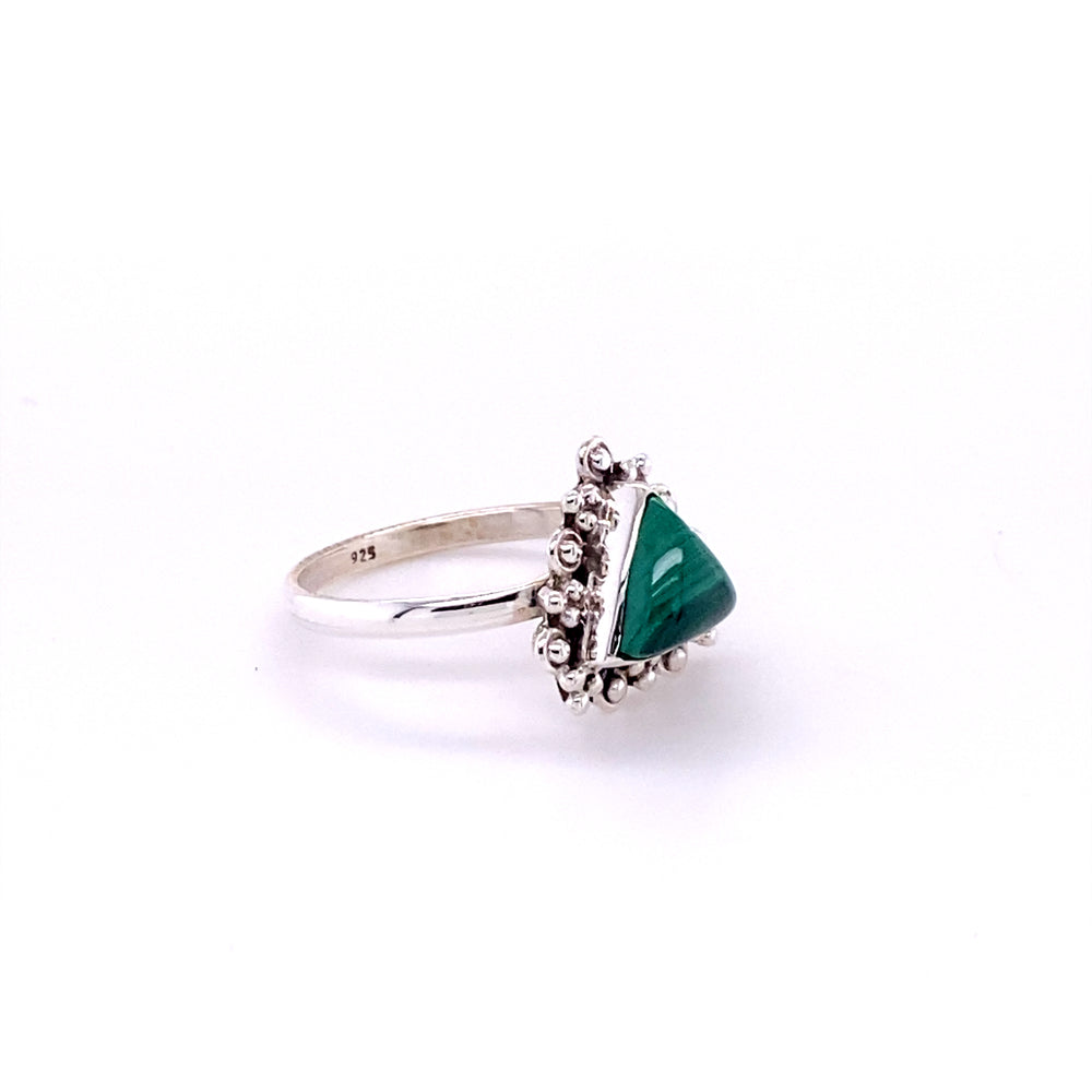 
                  
                    A Super Silver Delicate Gemstone Triangle Ring with a green stone in the middle.
                  
                