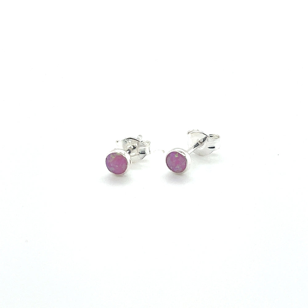 
                  
                    A pair of Dainty Opal Studs by Super Silver on a white background.
                  
                